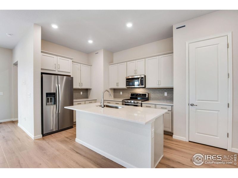 Furnished interior view inside a new home in Westside Crossing Paired Homes, Berthoud (Image 5).