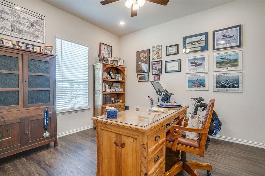 Home office featuring dark wood-style floors, ceiling fan, and recessed lighting Home office featuring dark wood-style floors, ceiling fan, and recessed lighting