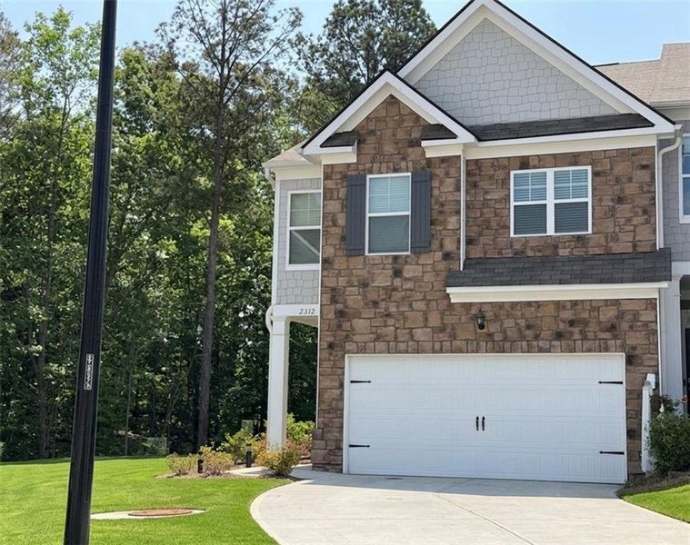 Front exterior of a new home in , Buford, GA, highlighting curb appeal (Image 1). Front exterior of a new home in , Buford, GA, highlighting curb appeal (Image 1).