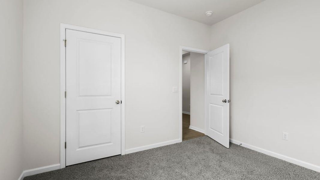 Spacious, unfurnished interior of a new home in Durbin Meadows Traditions, Fountain Inn (Image 18).
