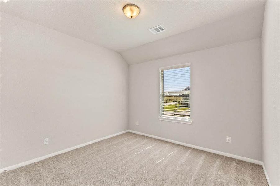 Your secondary bedroom features plush carpet, fresh paint, closet, and a large window that lets in plenty of natural lighting.