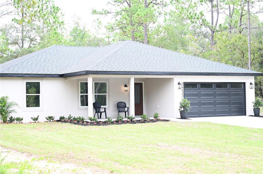 Front exterior of a new home in , Dunnellon, FL, highlighting curb appeal (Image 21).