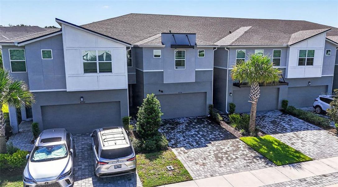 Front exterior of a new home in , Lutz, FL, highlighting curb appeal (Image 27).