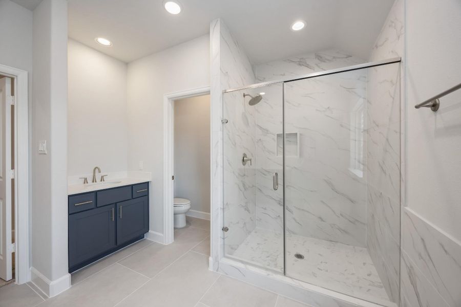 Shower in Style: Revel in the expansiveness of a large shower, standard with sleek finishes and a built-in niche, keeping essentials elegantly within reach. Shower in Style: Revel in the expansiveness of a large shower, standard with sleek finishes and a built-in niche, keeping essentials elegantly within reach.