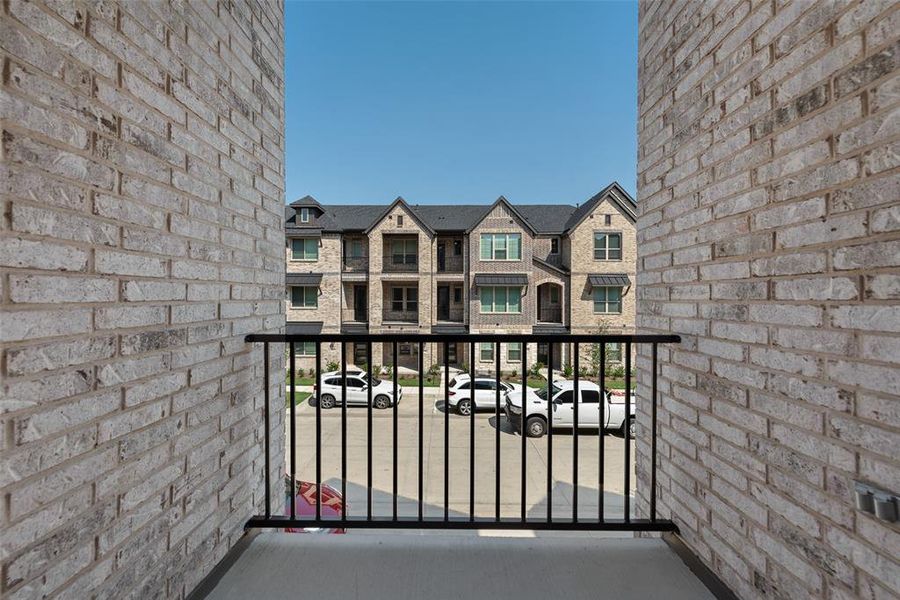 Front exterior of a new home in Wade Settlement Townhomes, Frisco, TX, highlighting curb appeal (Image 2).