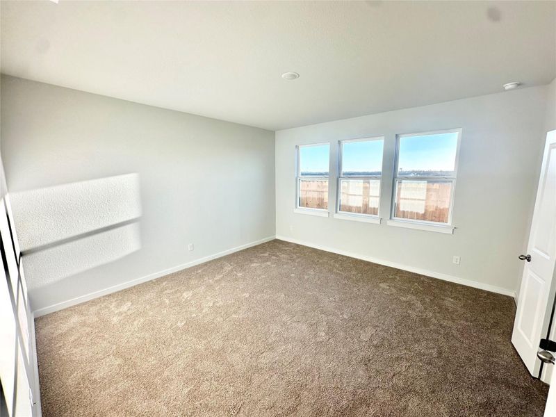 Empty room with baseboards and carpet flooring