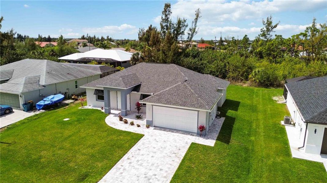 Front exterior of a new home in , Port Charlotte, FL, highlighting curb appeal (Image 2).