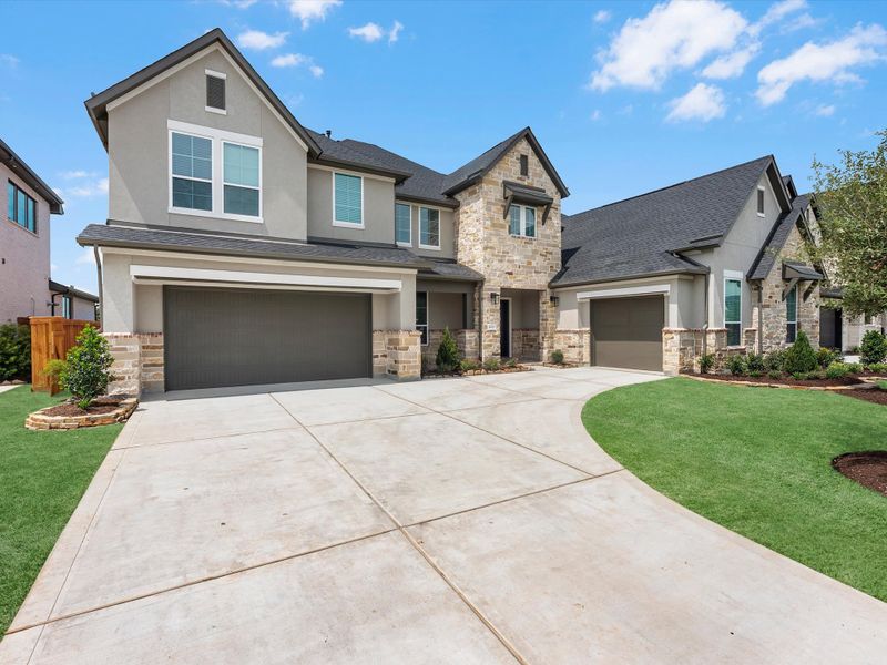 Front exterior of a new home in Dunham Pointe, Cypress, TX, highlighting curb appeal (Image 16). Front exterior of a new home in Dunham Pointe, Cypress, TX, highlighting curb appeal (Image 16).