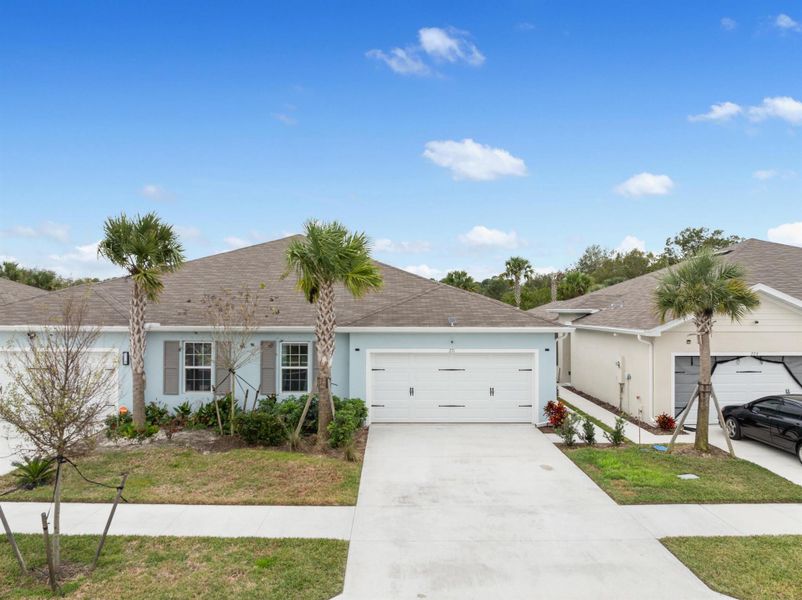 Front exterior of a new home in , Fort Pierce, FL, highlighting curb appeal (Image 23).