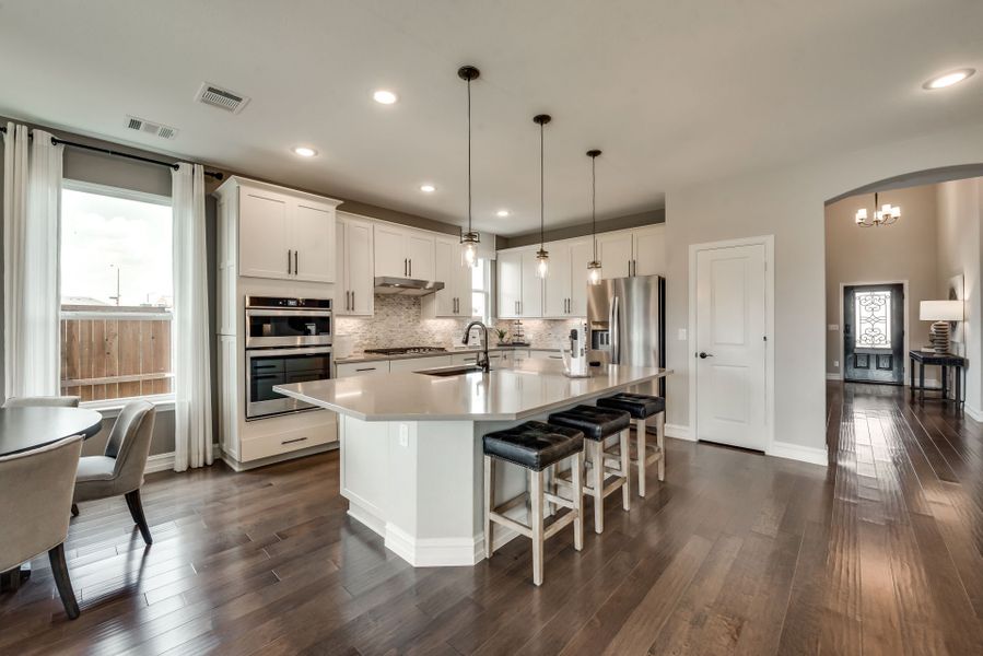 Island kitchen with built-in appliances