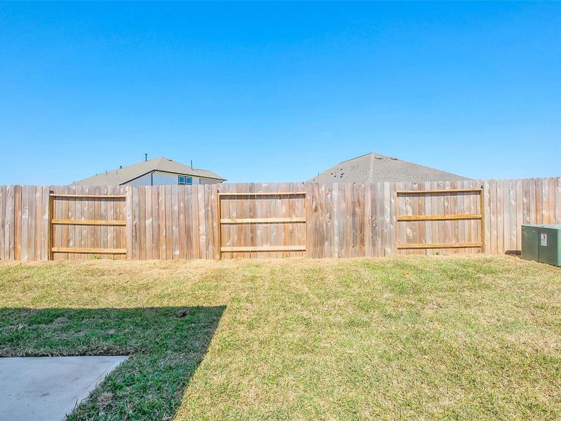 Exterior details and patio area of a home in Sunterra, Katy (Image 28).