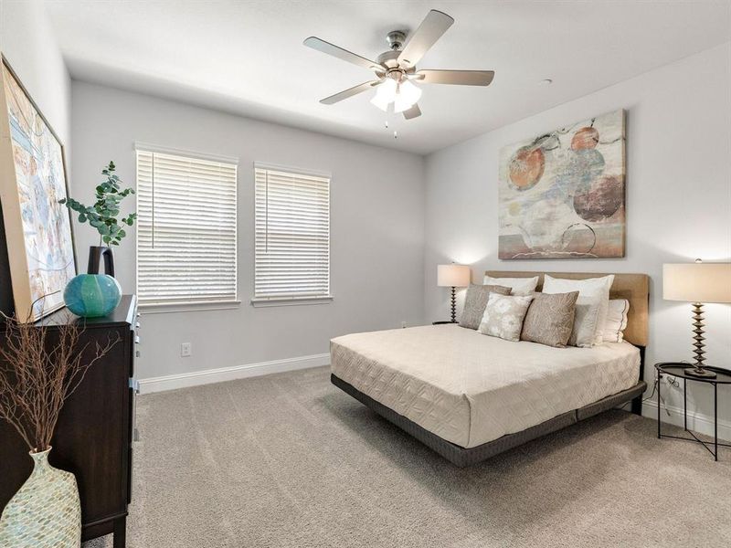 The primary bedroom retreat boasts a bright, serene environment and plenty of room for king-sized furniture.