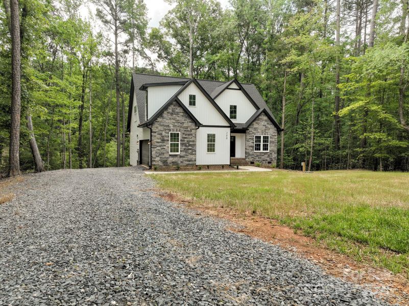 Front exterior of a new home in , Mount Gilead, NC, highlighting curb appeal (Image 14).