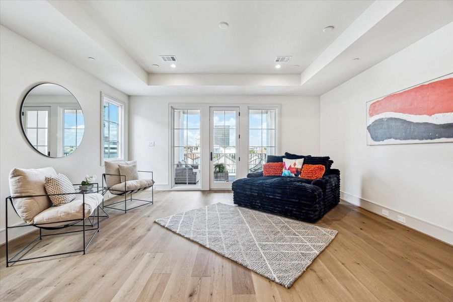 Looking out from the wet bar shows the City Room opening onto the fourth floor covered terrace. Looking out from the wet bar shows the City Room opening onto the fourth floor covered terrace.