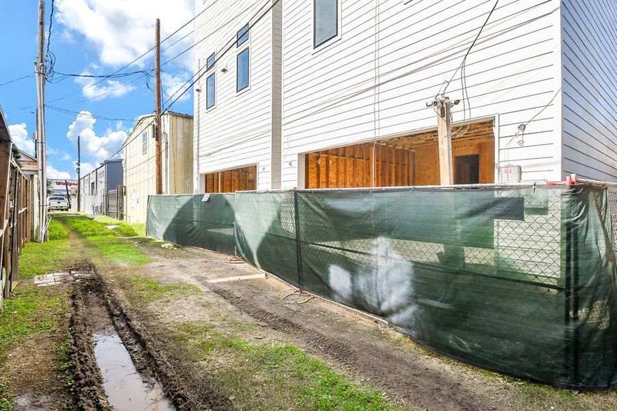 Back elevation with garage doors at Allely.