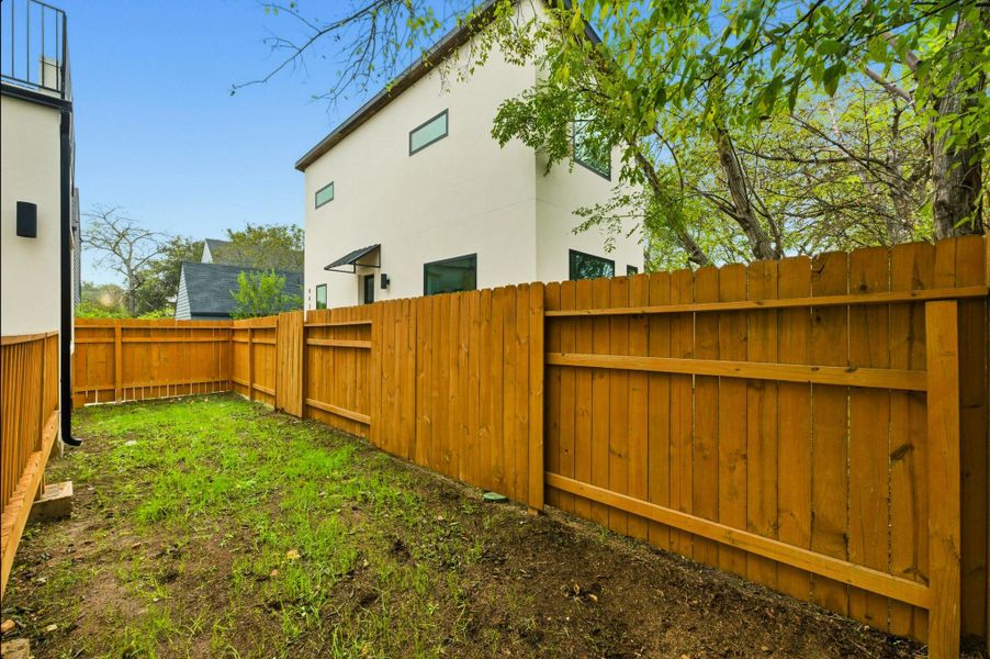 View of fenced backyard