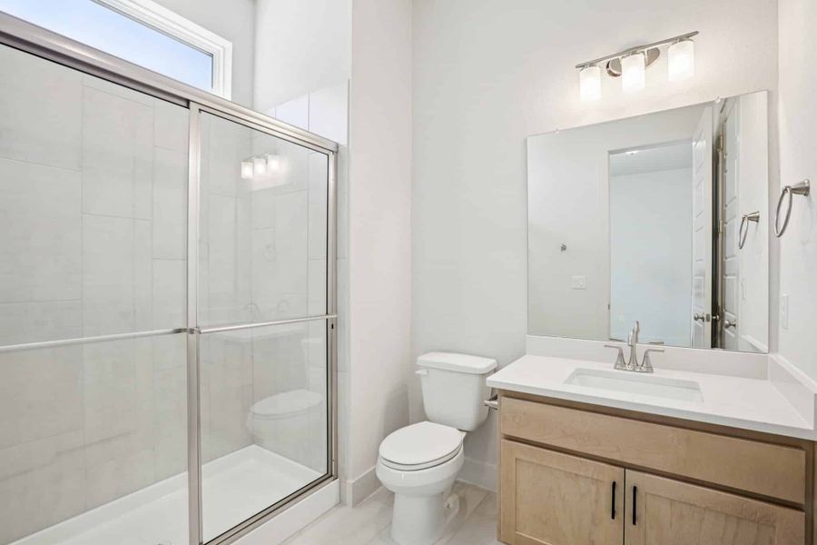Representative furnished interior of a home built from the Draco by Chesmar Homes in The Grove at Blackhawk, Pflugerville (Image 13).
