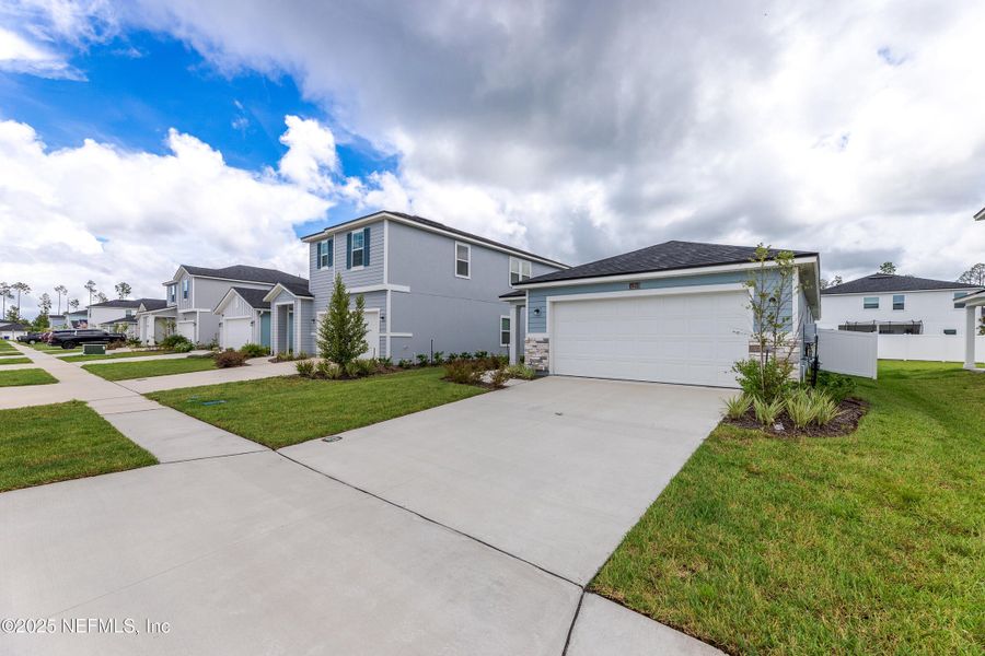 Front exterior of a new home in , St. Augustine, FL, highlighting curb appeal (Image 1). Front exterior of a new home in , St. Augustine, FL, highlighting curb appeal (Image 1).