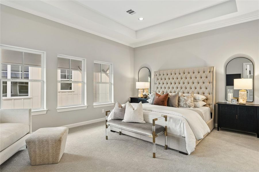 Primary suite offers high ceilings and a sense of tranquility.