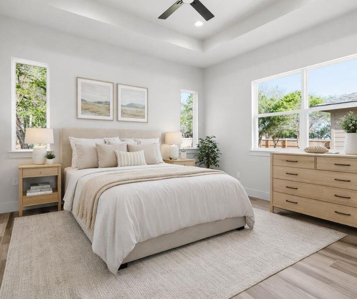 Primary bedroom on main level virtually staged