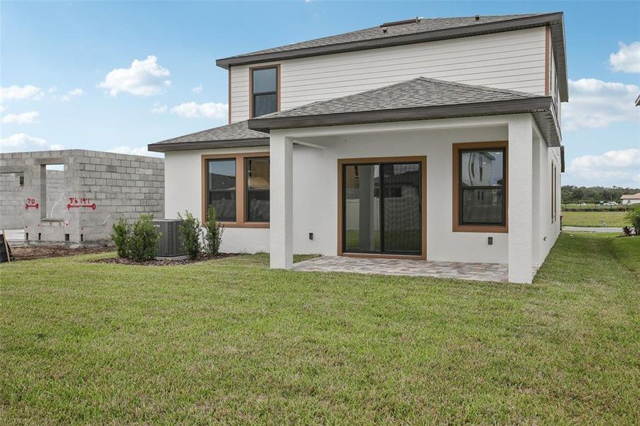 Exterior details and patio area of a home in Grasslands West, Lakeland (Image 24).