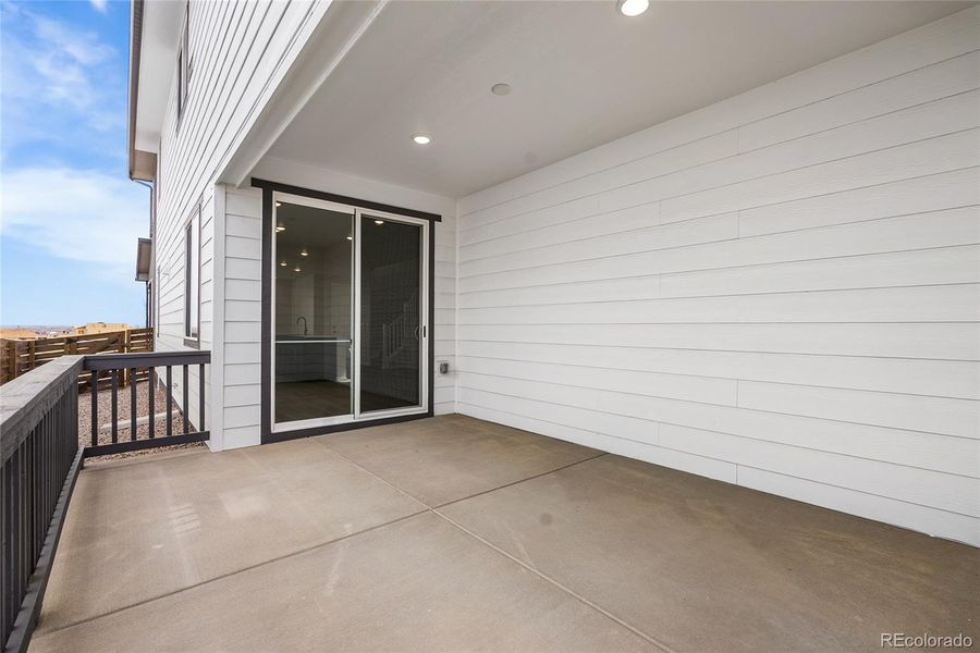 Exterior details and patio area of a home in Barefoot Village, Firestone (Image 20).