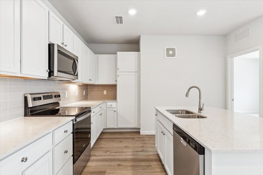 Furnished interior view inside a new home in Condo Collection at Grand Vue at Interlocken, Broomfield (Image 3).