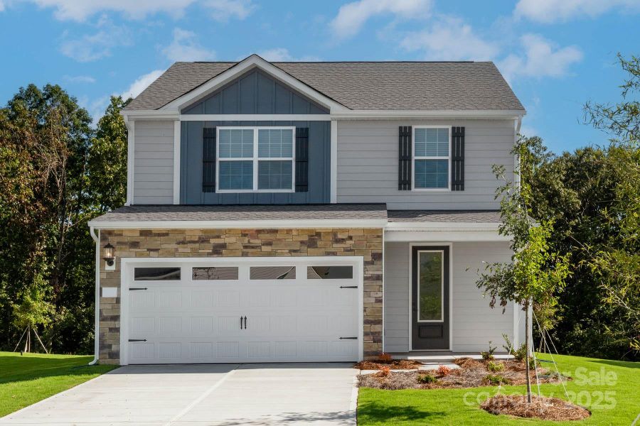 Front exterior of a new home in Village at Granite, Salisbury, NC, highlighting curb appeal (Image 1). Front exterior of a new home in Village at Granite, Salisbury, NC, highlighting curb appeal (Image 1).
