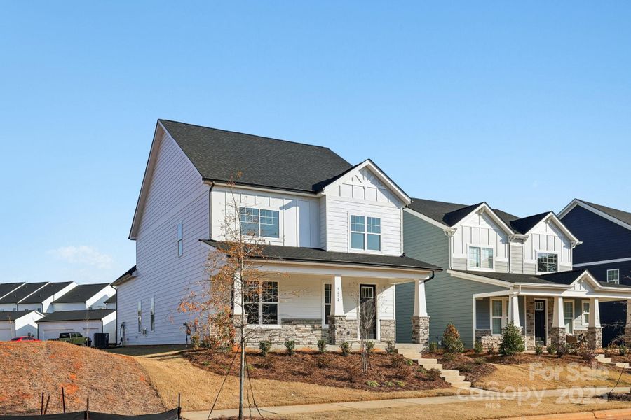 Front exterior of a new home in Edgewood Preserve, Huntersville, NC, highlighting curb appeal (Image 2).