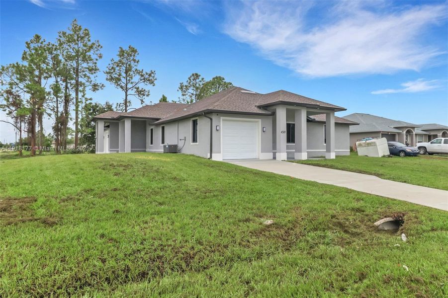 Front exterior of a new home in , Lehigh Acres, FL, highlighting curb appeal (Image 21). Front exterior of a new home in , Lehigh Acres, FL, highlighting curb appeal (Image 21).