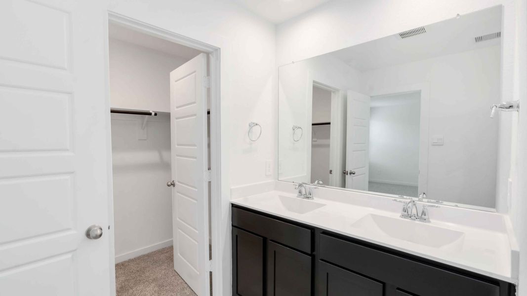 Representative furnished interior of a home built from the Jasmine by D.R. Horton in City Gate North, Houston (Image 5).