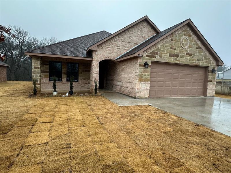 View of front of home featuring a garage