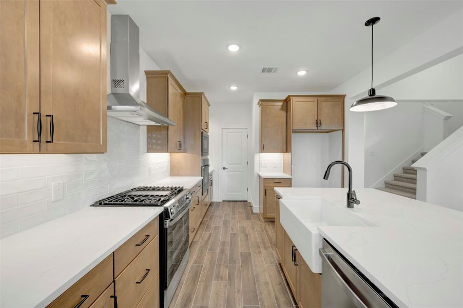 Lovely kitchen with chestnut brown cabinets (*Photo not of actual home and used for illustration purposes only.) Lovely kitchen with chestnut brown cabinets (*Photo not of actual home and used for illustration purposes only.)