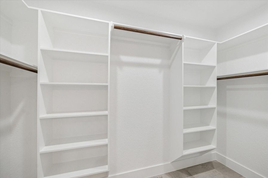 Primary closet with plenty of storage