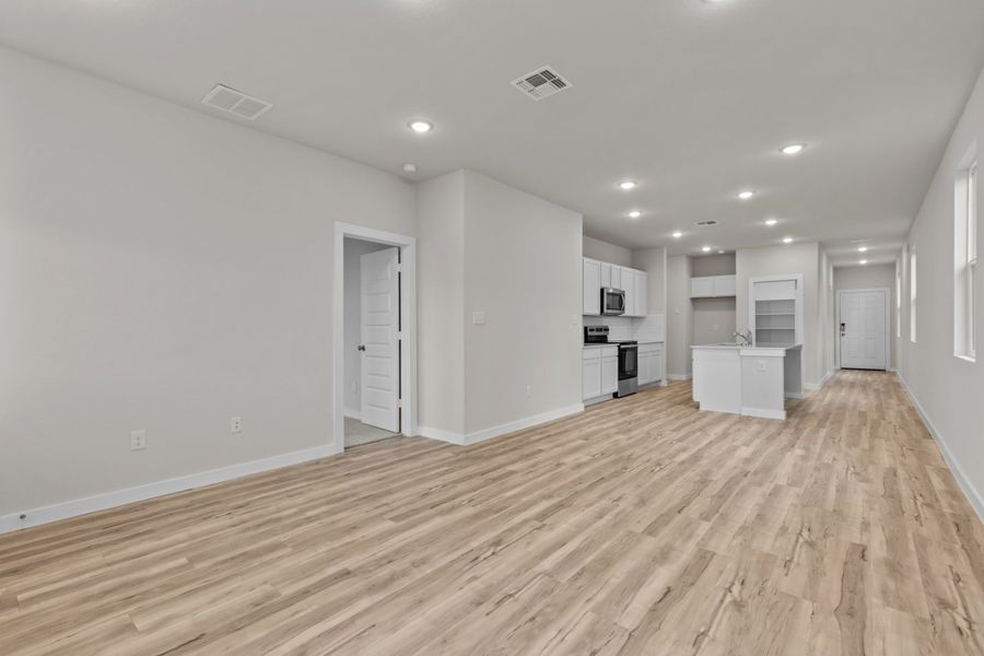 A room with white walls and wood floors. A room with white walls and wood floors.