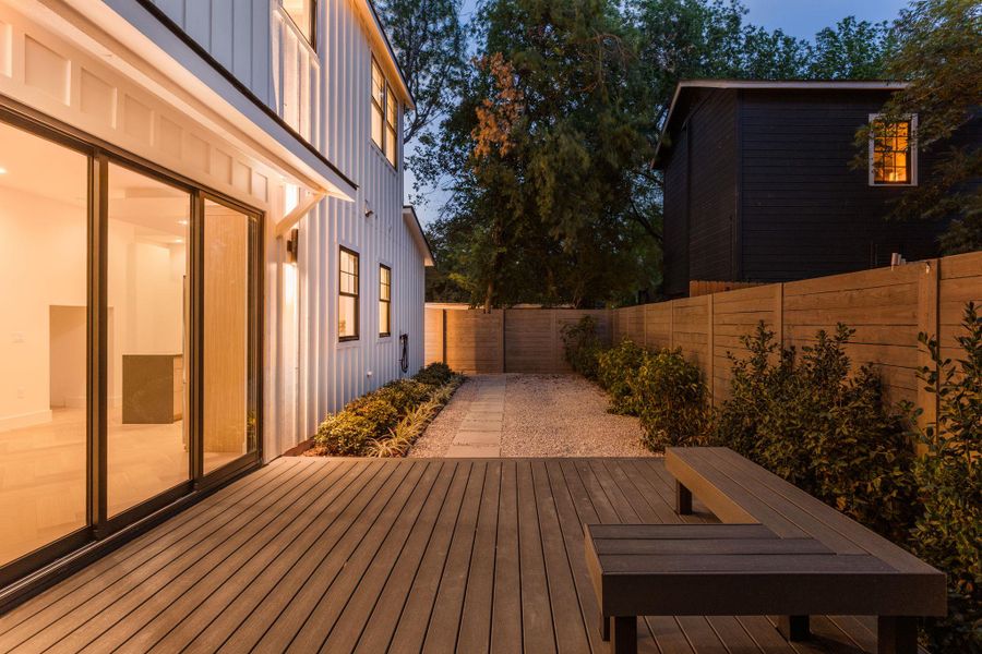 Wooden terrace with a fenced backyard Wooden terrace with a fenced backyard