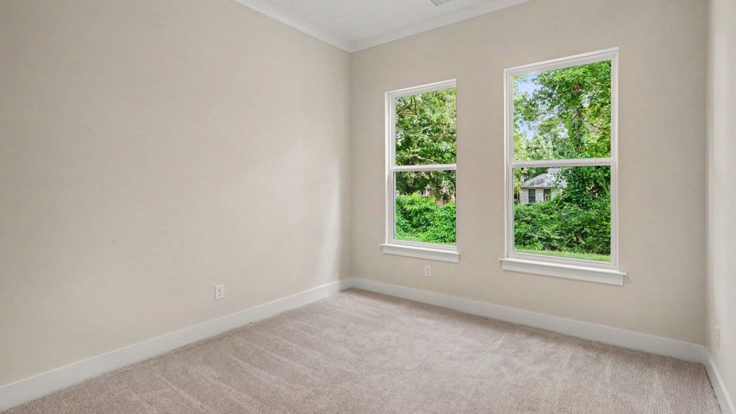 Secondary bedroom with carpet and windows Secondary bedroom with carpet and windows