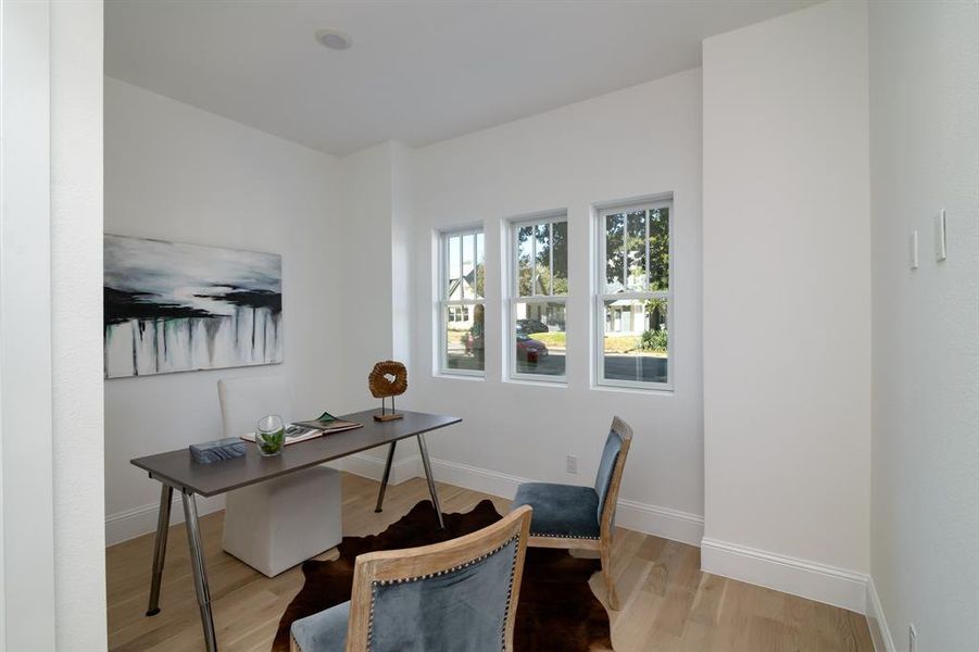 Office area featuring light hardwood / wood-style flooring