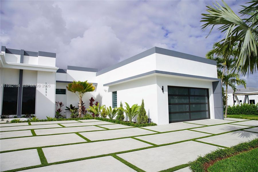 Front exterior of a new home in , Miami, FL, highlighting curb appeal (Image 23).