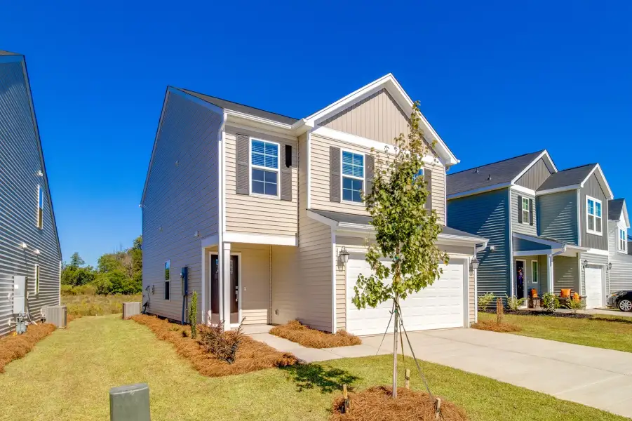 Front exterior of a new home in Laurinton Farms, Hopkins, SC, highlighting curb appeal (Image 21).