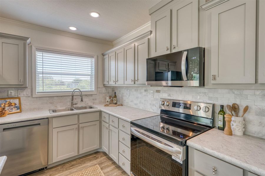A well-appointed kitchen showcasing contemporary appliances and abundant cabinet storage. A well-appointed kitchen showcasing contemporary appliances and abundant cabinet storage.