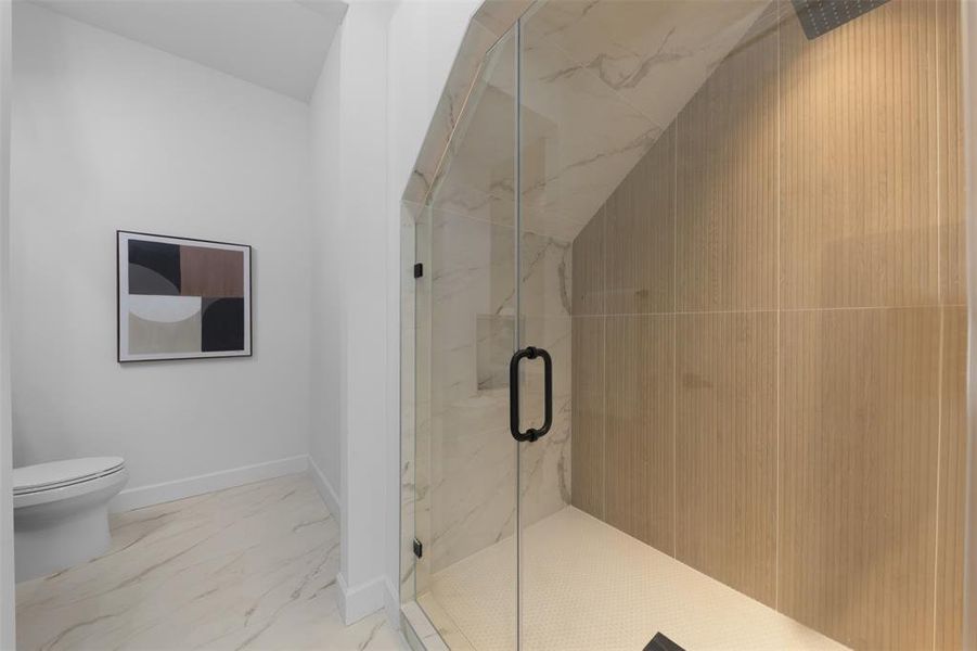 Full bathroom with a marble finish shower and marble finish flooring