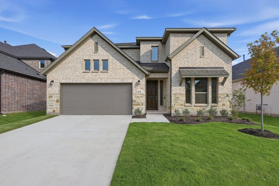 Front exterior of a new home in The Ridge at Northlake, Northlake, TX, highlighting curb appeal (Image 1). Front exterior of a new home in The Ridge at Northlake, Northlake, TX, highlighting curb appeal (Image 1).