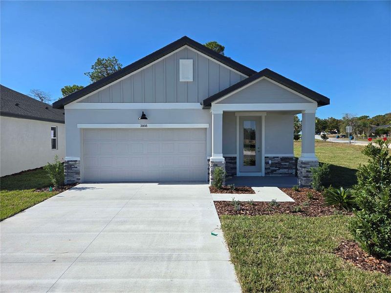 Front exterior of a new home in Arbor Meadows, Spring Hill, FL, highlighting curb appeal (Image 1). Front exterior of a new home in Arbor Meadows, Spring Hill, FL, highlighting curb appeal (Image 1).