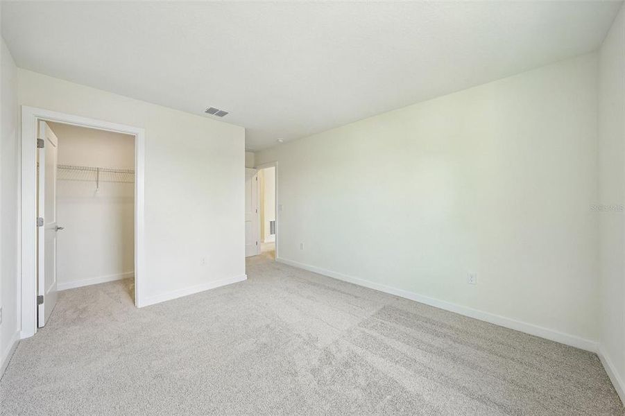 Spacious, unfurnished interior of a new home in Grasslands West, Lakeland (Image 18).