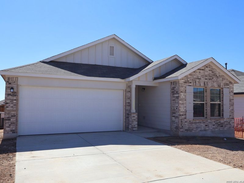 Front exterior of a new home in Hunters Ranch, San Antonio, TX, highlighting curb appeal (Image 23).
