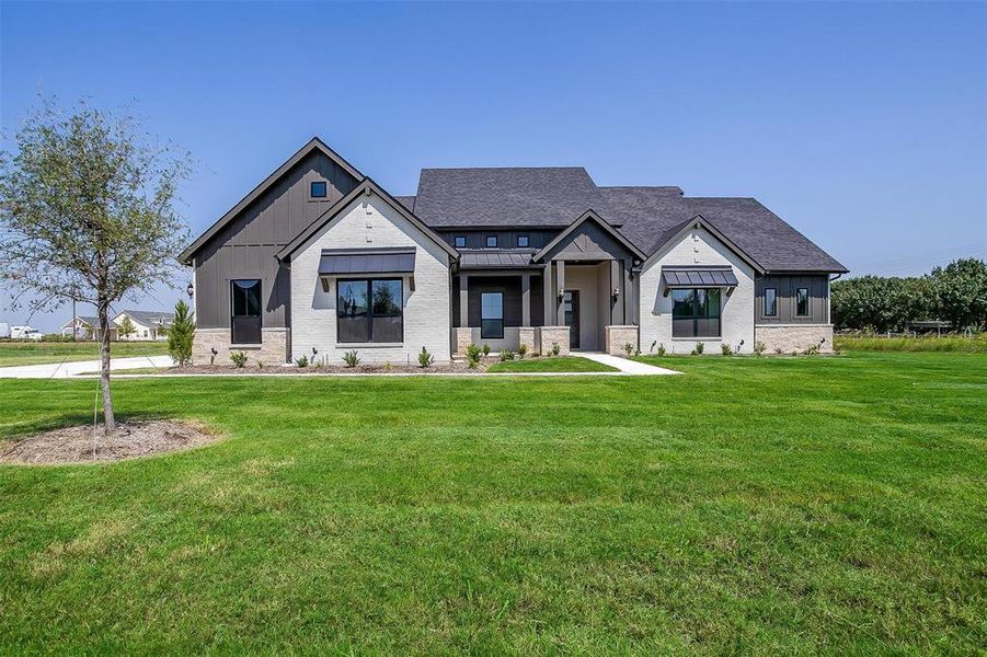 View of front of house with a front lawn