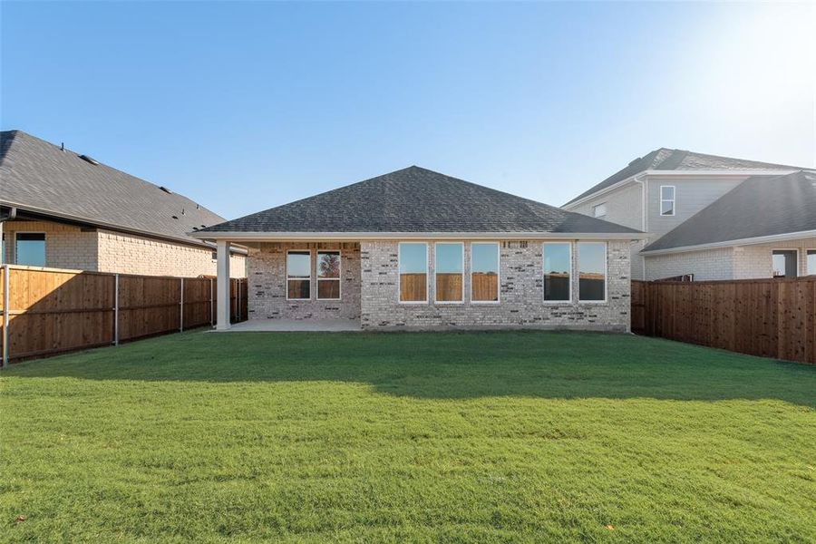 Exterior details and patio area of a home in Wildflower Ranch, Justin (Image 4).