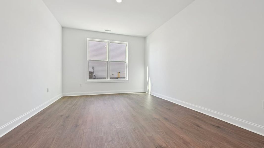 Representative unfurnished interior of a home built from the Wylie by D.R. Horton in Eagle Creek, Fuquay Varina (Image 17).