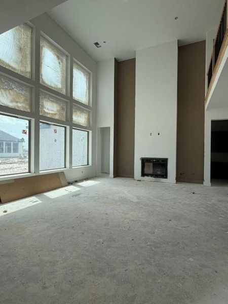 The family room wall of windows floods the space with natural light. The family room wall of windows floods the space with natural light.